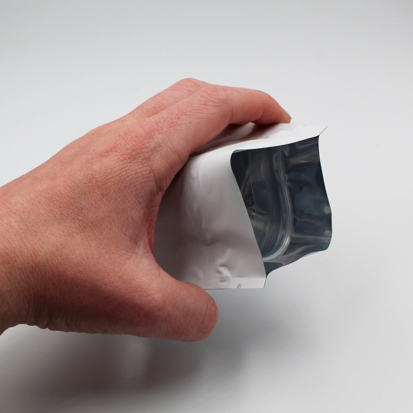 1/2oz (14g) White Opaque Child-Resistant GriploK Mylar Dispensary Bag with Film Above Zipper (Opened by Hand)