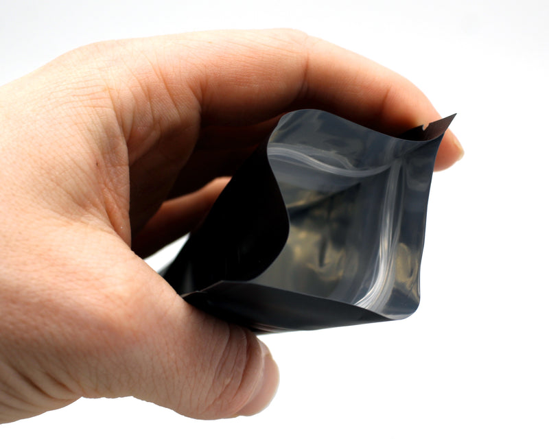 1/8oz (3.5g) Opaque Black Child-Resistant GriploK Mylar Dispensary Bag with Film Above Zipper (Opened by Hand)