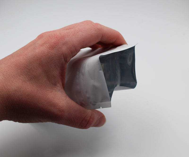 1/4oz (7g) Opaque White Child-Resistant GriploK Mylar Dispensary Bag with Film Above Zipper (Opened)
